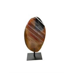 Agate crystal slice, raised on a black metal stand, H16cm