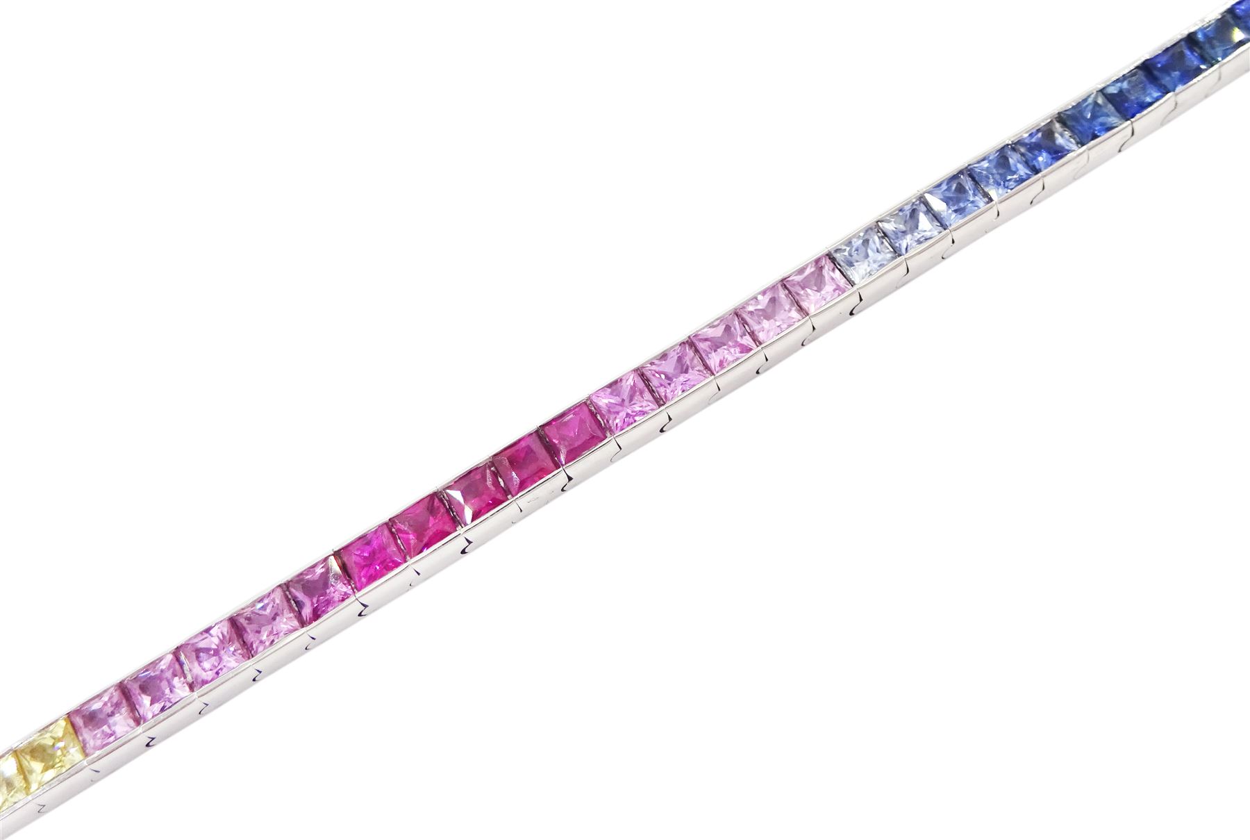 18ct white gold channel set multicoloured sapphire bracelet, sixty-one princess cut sapphires, various hues including blue, pink, green, yellow and teal, London 2004