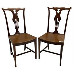 Early 20th century pair of mahogany side chairs, shaped cresting rail over shaped and pierced splat carved with curled leaf decoration, dished seat on square tapering supports united by H-stretchers 