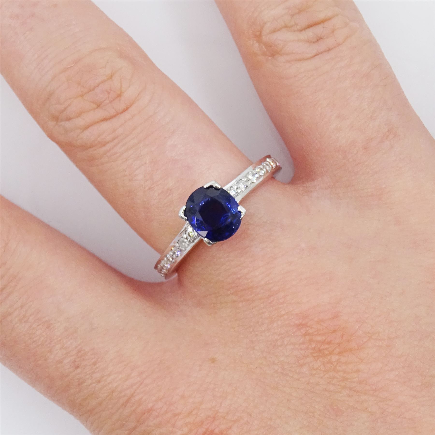 18ct white gold oval cut Ceylon sapphire ring, with diamond set shoulders, hallmarked, sapphire approx 1.25 carat