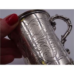 Victorian silver christening mug, of cylindrical form with fluted rim, gilt interior and acanthus capped C scroll handle, the body with later engraved decoration and initials, with embossed scroll base, hallmarked John Evans II, London 1840, including handle H10.2cm