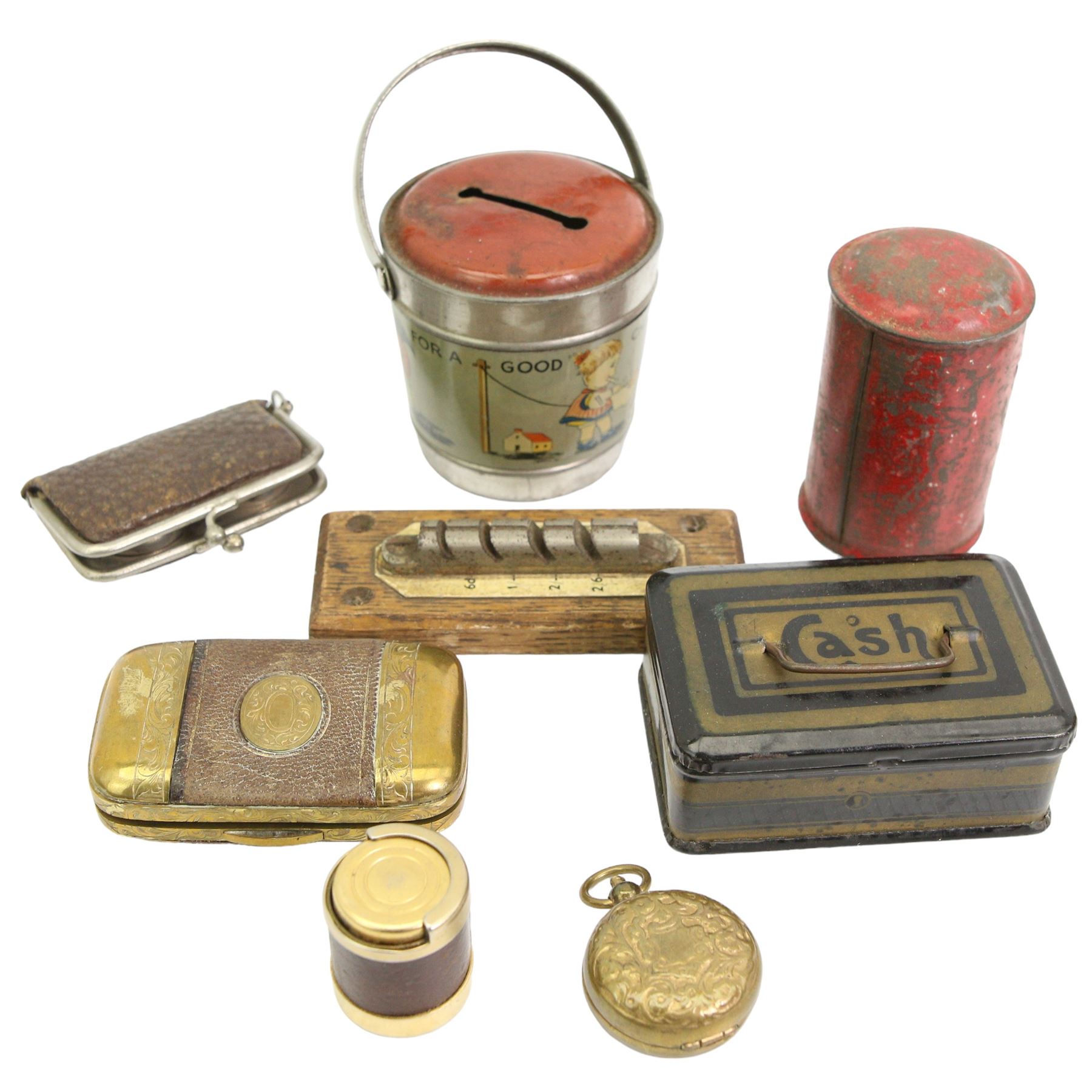 Two early 20th century sovereign holders, The Realm Counterfeit Coin Detector, by the Specialty Mfg. Co., Manchester, children's tin money box, post box money box etc 