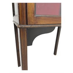 Early 20th century mahogany display cabinet, projecting moulded cornice over inlaid frieze, single astragal glazed door opening to reveal three felt-lined shelves, raised on square tapering supports