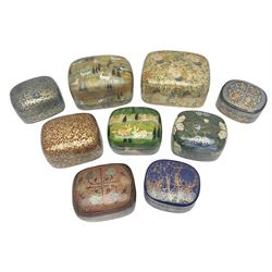 Nine lacquered boxes, all rectangular form, including russian examples decorated with animals within a stylized landscapes and example with flower decoration, largest H7cm, L11cm