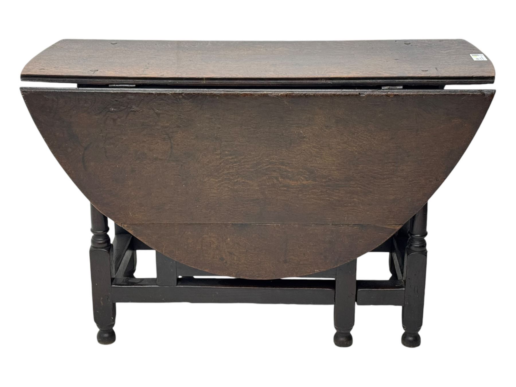 18th century oak dining table, oval drop-leaf top on gate-leg action base, turned supports united by stretchers 