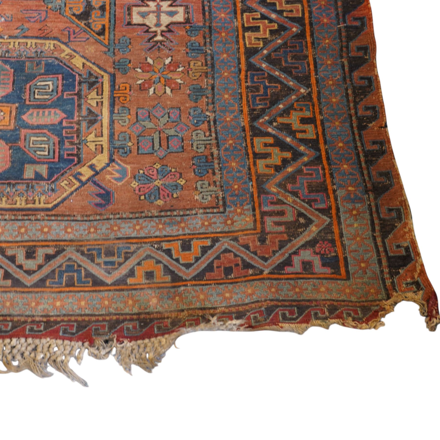 Old Persian red ground flat woven carpet, the field with three large medallions surrounded by small stylised flower head motifs, geometric border enclosed within running water band 346