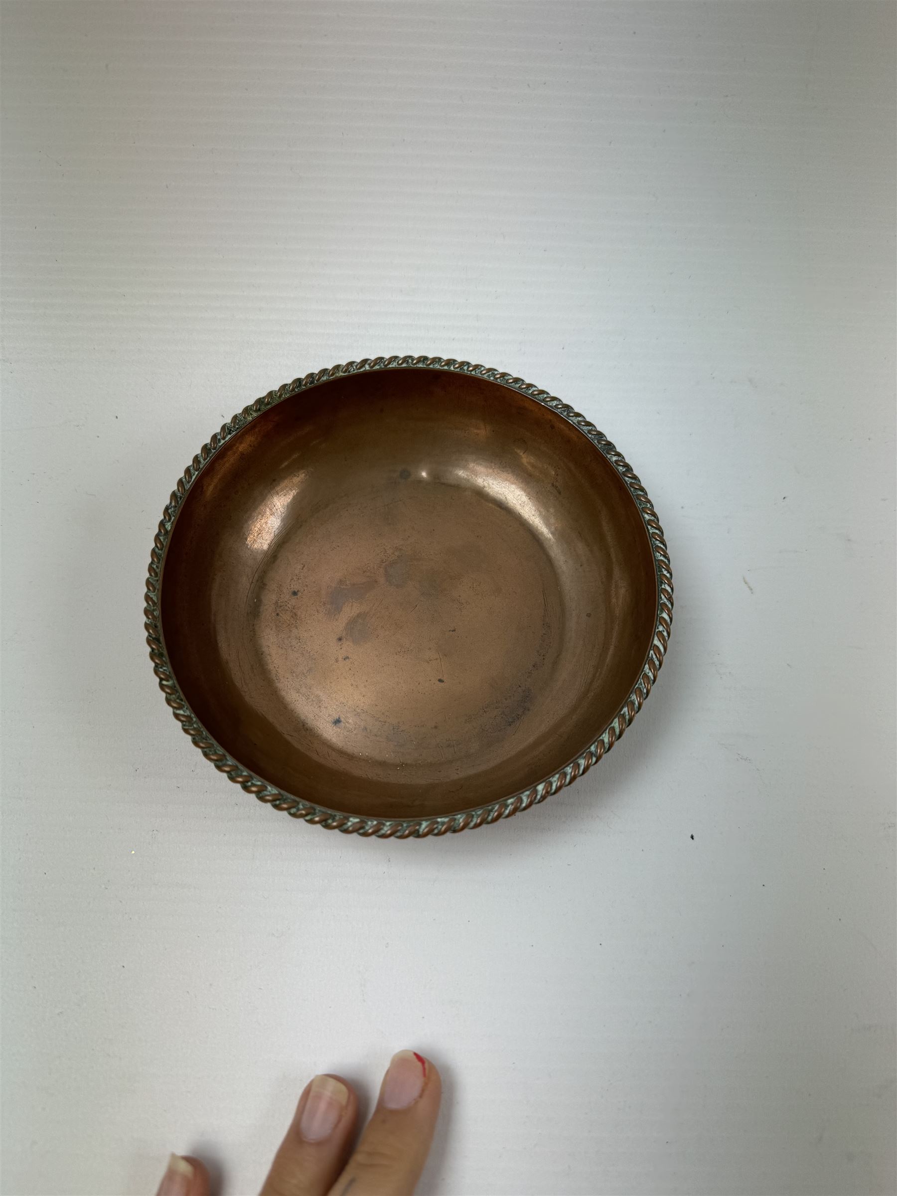 Pair of Arts & Crafts copper dishes by Gordon Russell, with lightly hammered finish and oblique gadrooned rim, impressed beneath 'Golf Hotel Grange Over Sands' and with maker's mark for Lygon