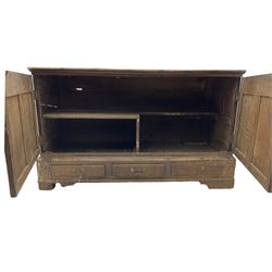 Georgian oak converted mule chest, rectangular plank top over two cupboards with arched Gothic motif panels enclosing storage area with shelves, the base with three drawers with pull handles, on shaped bracket feet