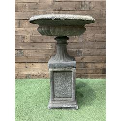 Pair of Victorian design cast stone squat garden urns, egg and dart border, raised on pedestal base and square fielded plinth - THIS LOT IS TO BE COLLECTED BY APPOINTMENT FROM DUGGLEBY STORAGE, GREAT HILL, EASTFIELD, SCARBOROUGH, YO11 3TX