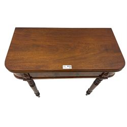 19th century mahogany tea table, fold-over swivel action rectangular top with rounded corners, figured frieze with stepped lozenge mounts, on turned supports