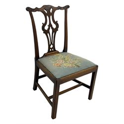 George III Chippendale design dining chair, shaped cresting rail carved with foliate scrolls over pierced and carved splat, floral needle-work upholstered drop-in seat, on square moulded supports united by H-stretchers 