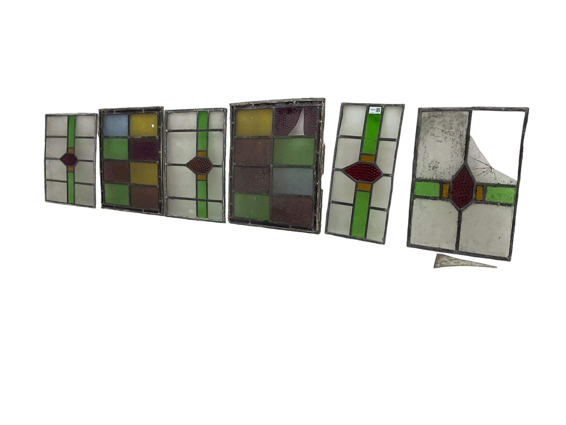 Six leaded stained glass window panes, largest measuring - 46cm x 41cm