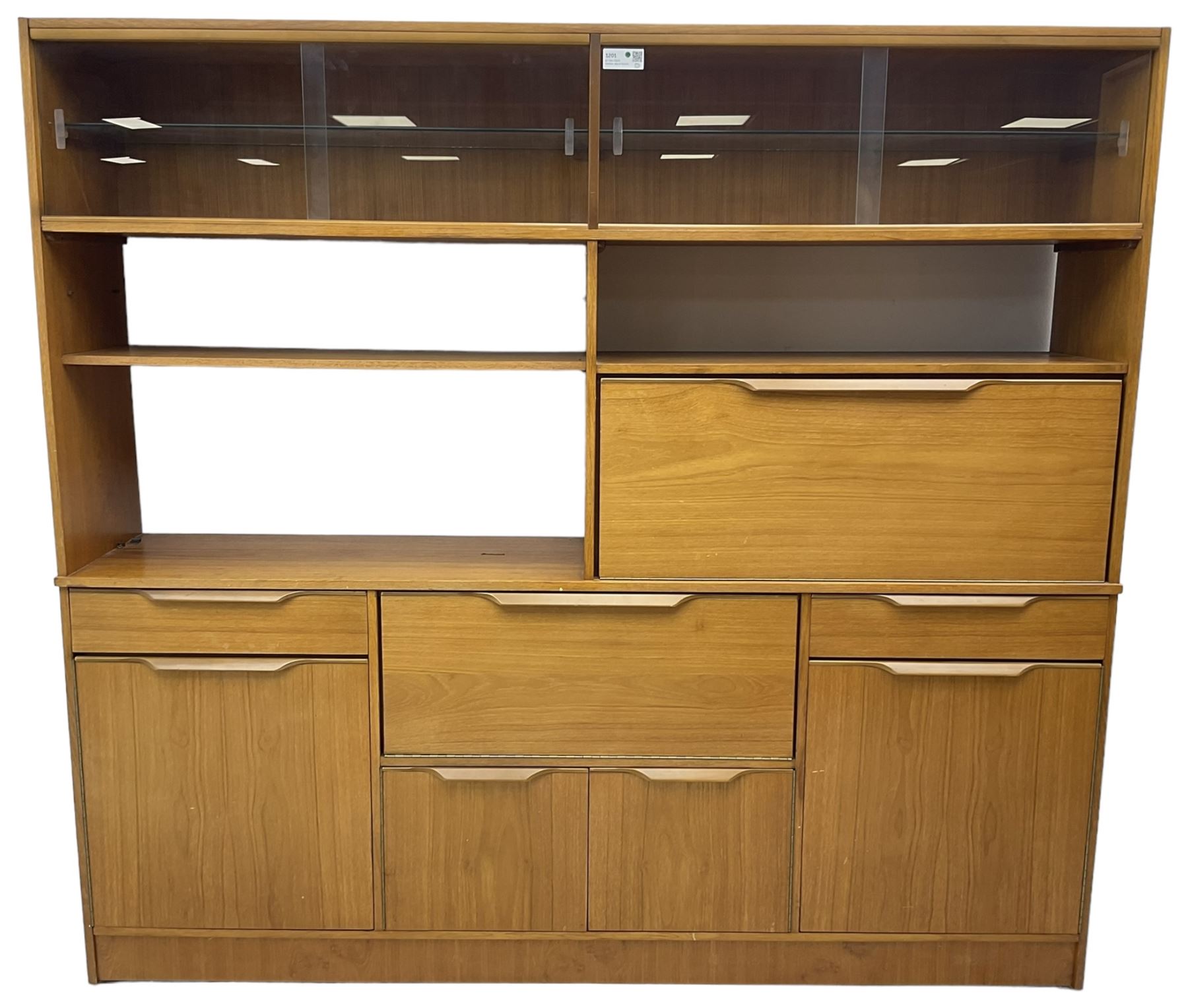 Mid-20th century teak sectional wall unit, combination of cupboards and drawers, raised sliding glass doors