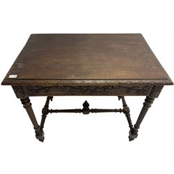 19th century walnut side table,  rectangular top with lunette carved moulded edge, the frieze drawer carved with ribbon and extending vine branch and grapes, on turned and fluted supports united by fluted stretcher with centre finial 