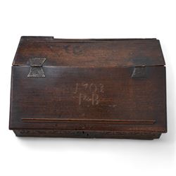 Early 18th century oak bible box, sloped hinged lid inscribed '1703 P.B', the front and sides carved with foliate scroll bands