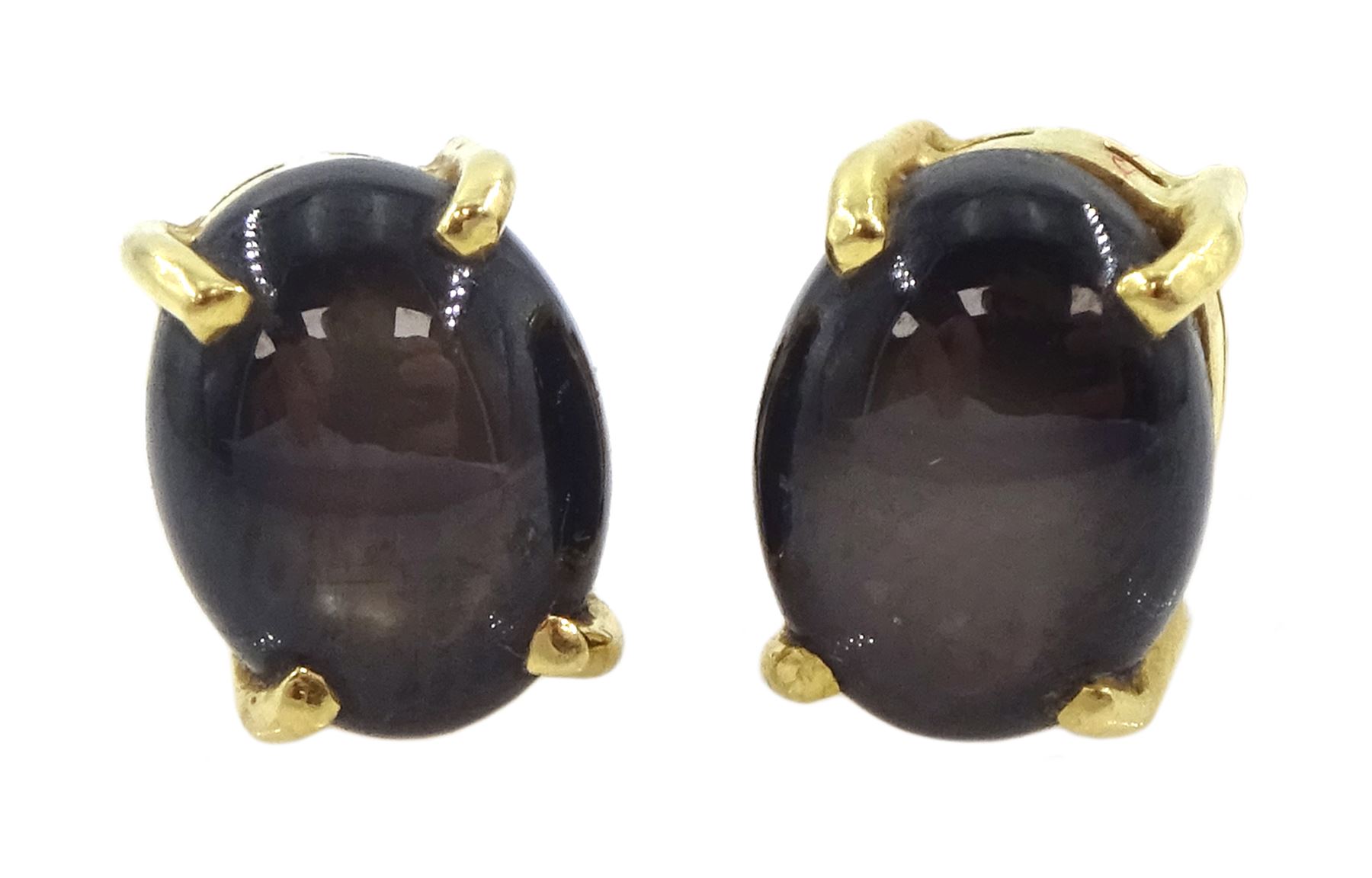 Pair of gold black / brown star sapphire stud earrings