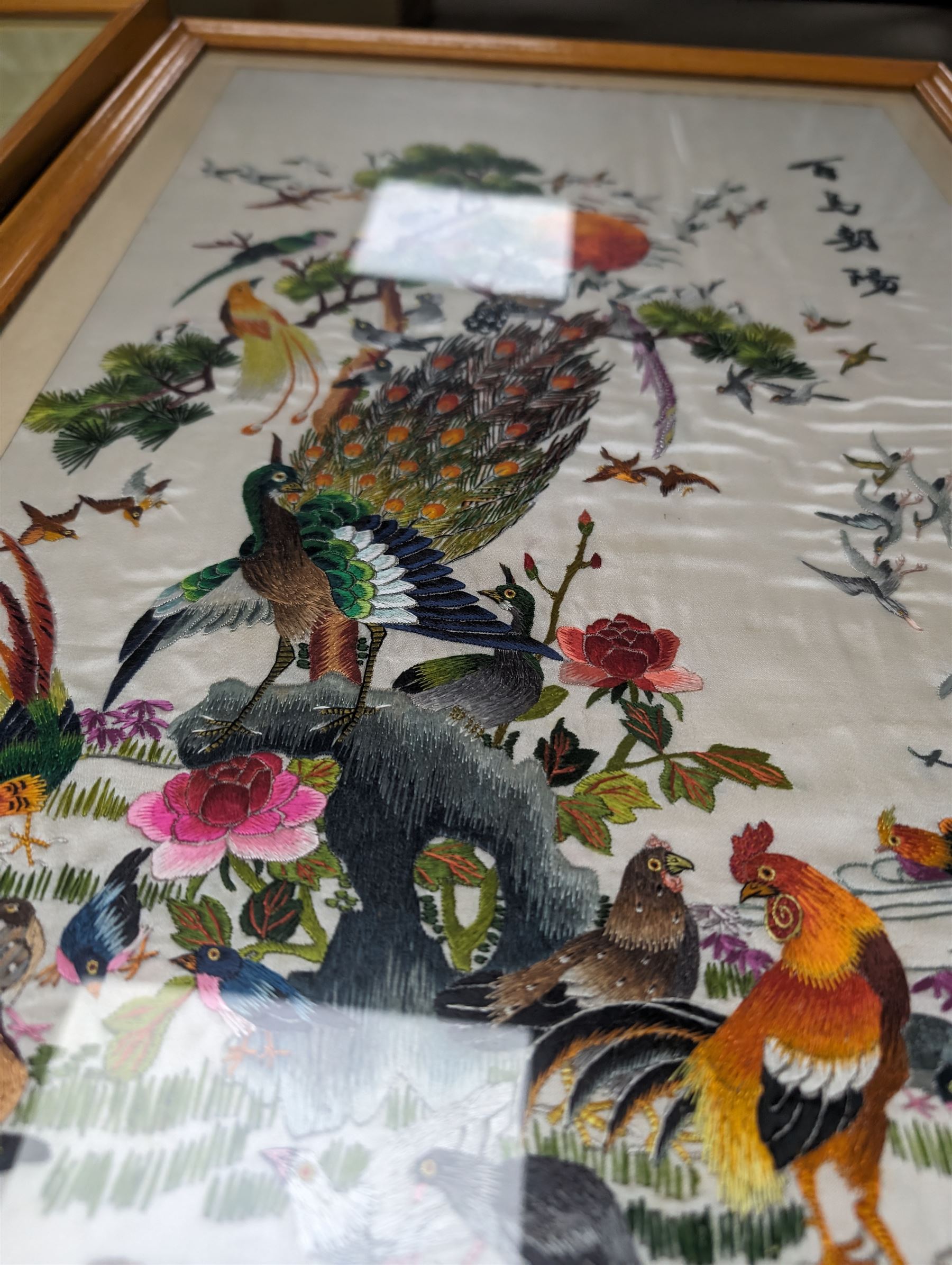 Two mid century Chinese embroidered silk panels, in wooden frames 