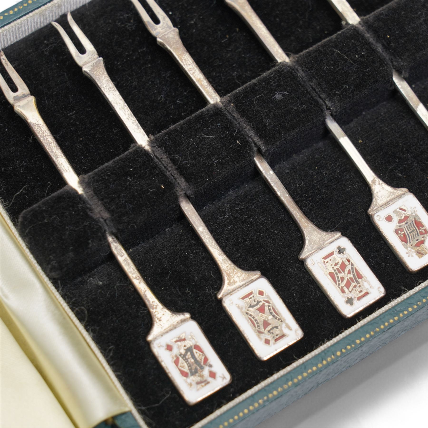 Set of twelve mid 20th century silver pickle forks, the terminals with enamelled playing card decoration, hallmarked Garrard & Co Ltd, Birmingham 1961, in original case