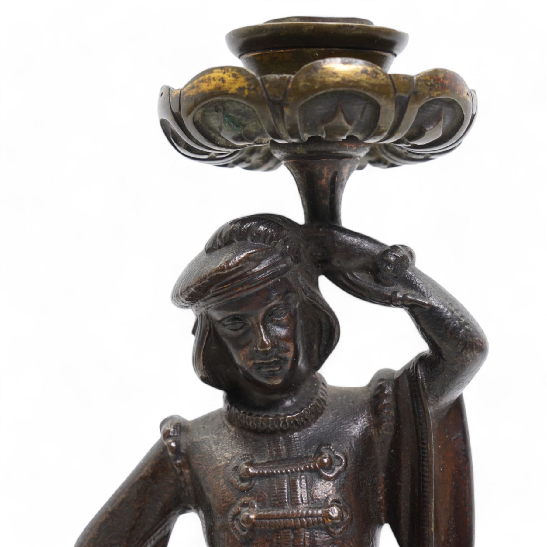 19th century continental bronze candle holder, the column formed as a courtier in Italian dress supporting the sconce, H31cm 