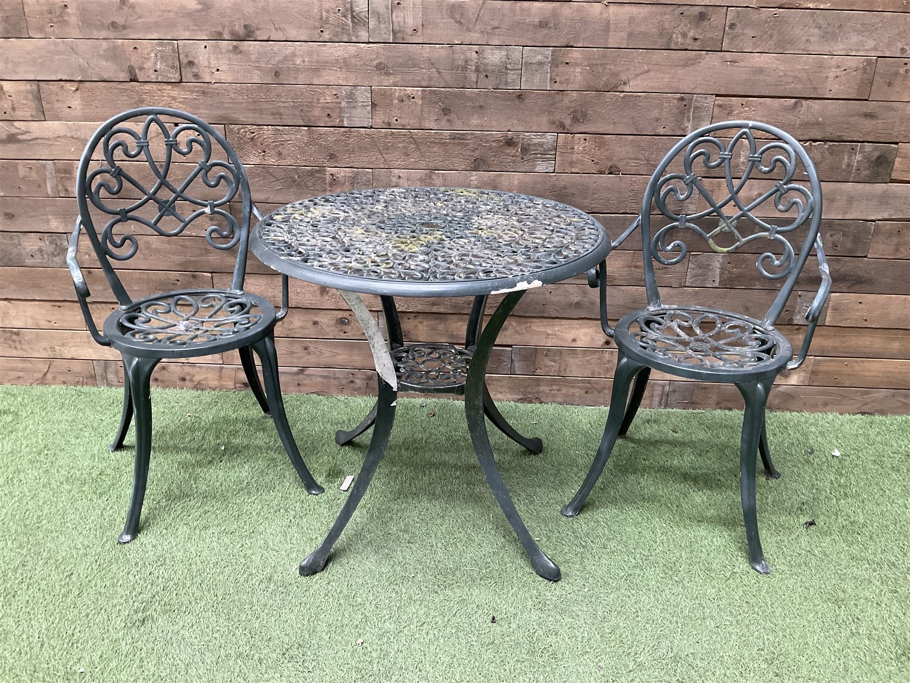 Green painted aluminium circular garden table and two chairs - THIS LOT IS TO BE COLLECTED BY APPOINTMENT FROM DUGGLEBY STORAGE, GREAT HILL, EASTFIELD, SCARBOROUGH, YO11 3TX