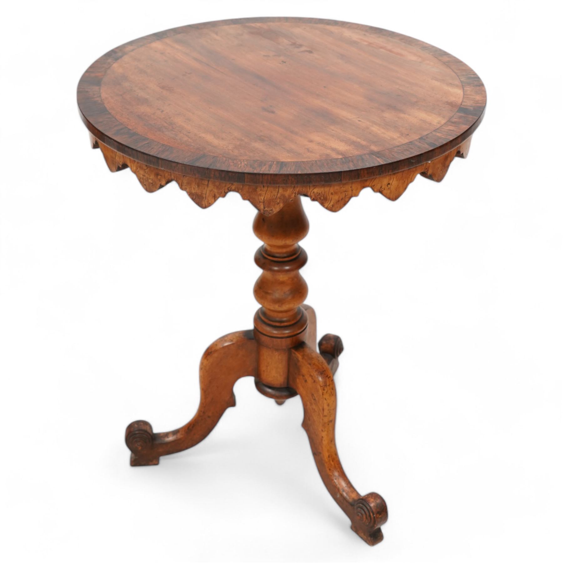 19th century rosewood and mahogany tripod table, circular tilt-top with rosewood band and shaped fretwork skirt, on turned column with three splayed supports with block feet 