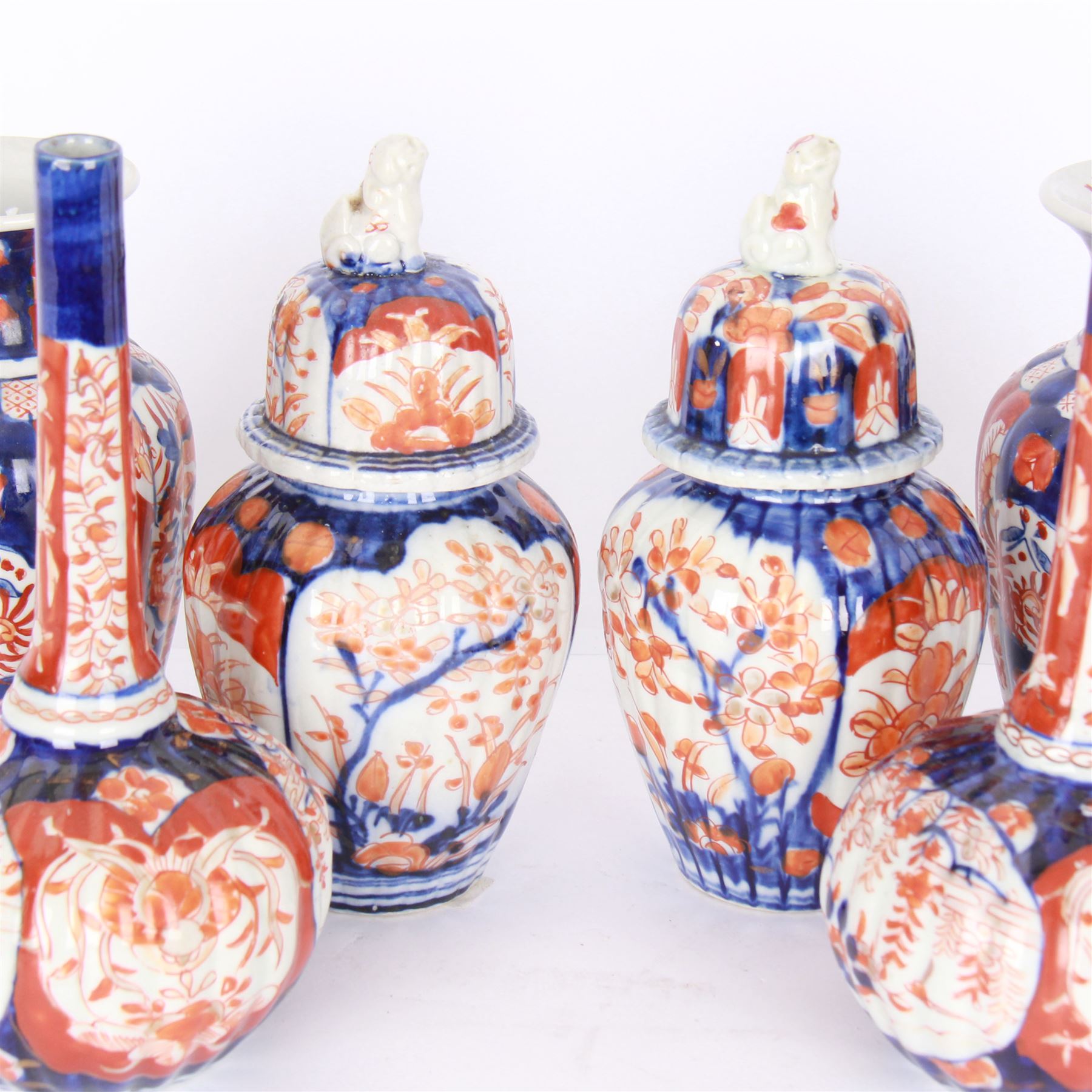 Three pairs of Imari vases, including a pair of baluster form with covers with foo dog finials, tallest H21cm 