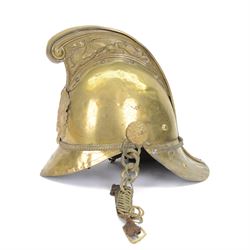 British fire brigade Merryweather pattern brass helmet, with a leather inner, and chain ch...