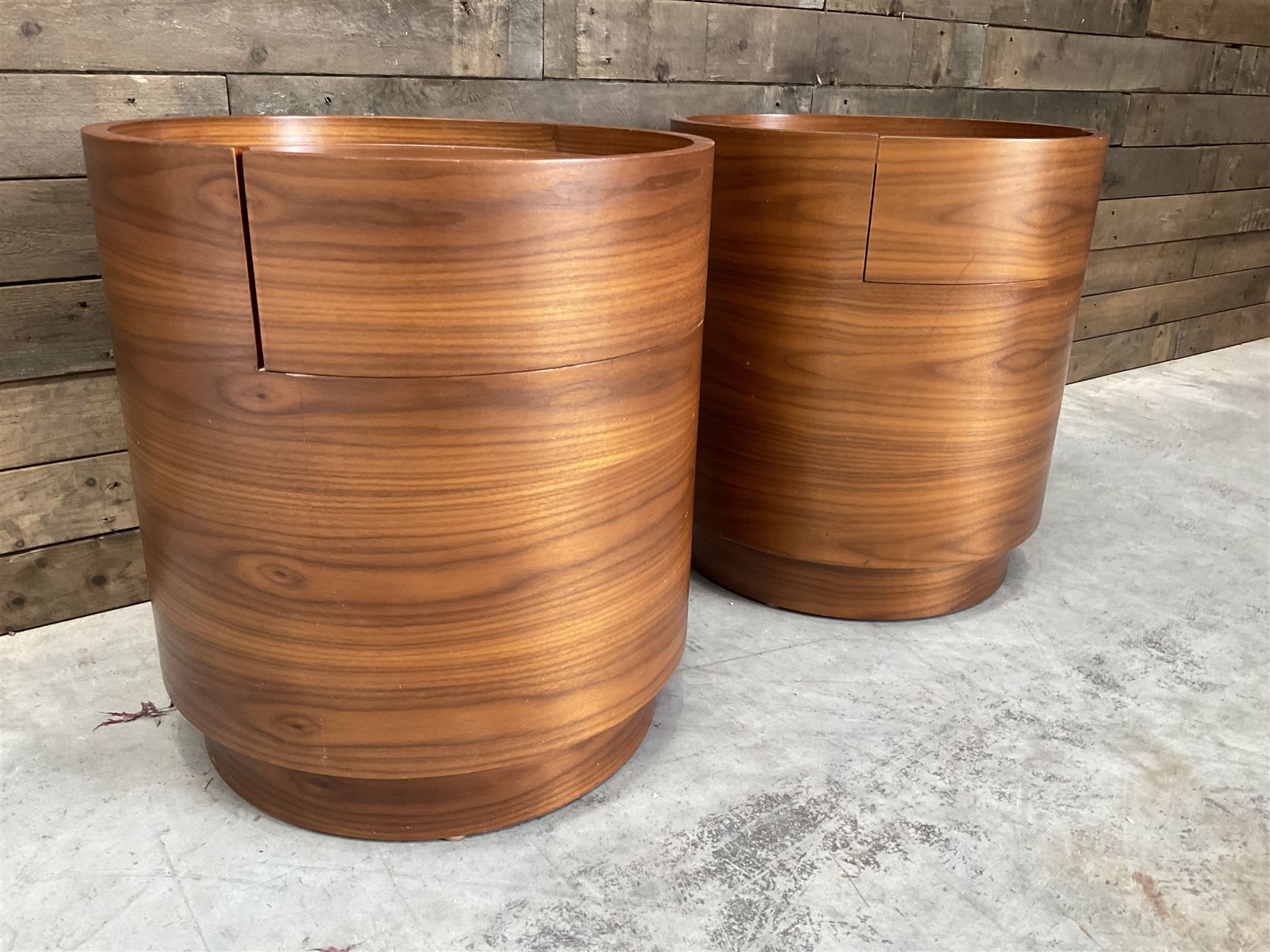 Pair of walnut circular barrel shaped lamp tables, fitted with single drawer