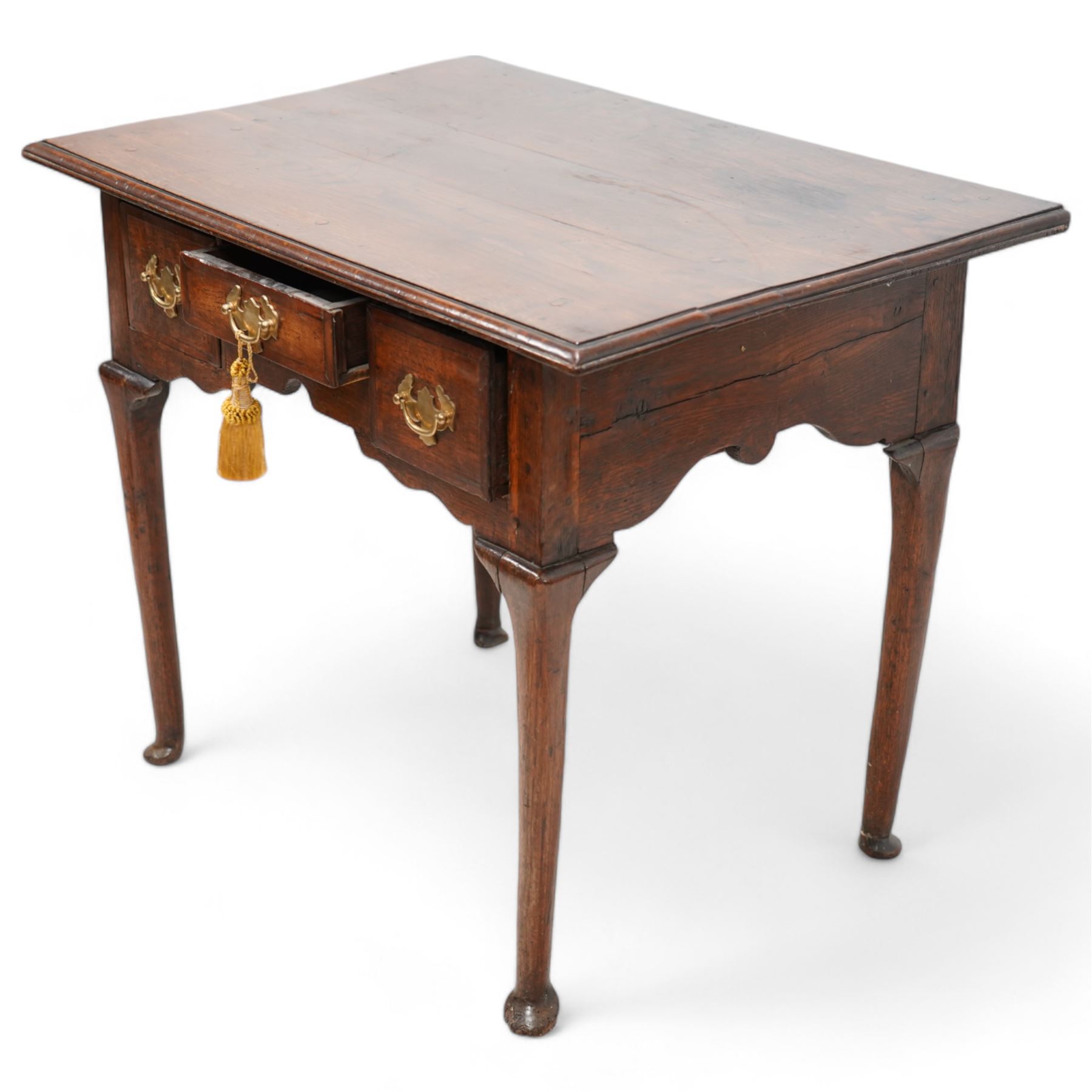 18th century country oak low-boy, rectangular top with moulded edge, fitted with three cross-banded drawers with brass handle plates, shaped apron on cabriole supports with pad feet