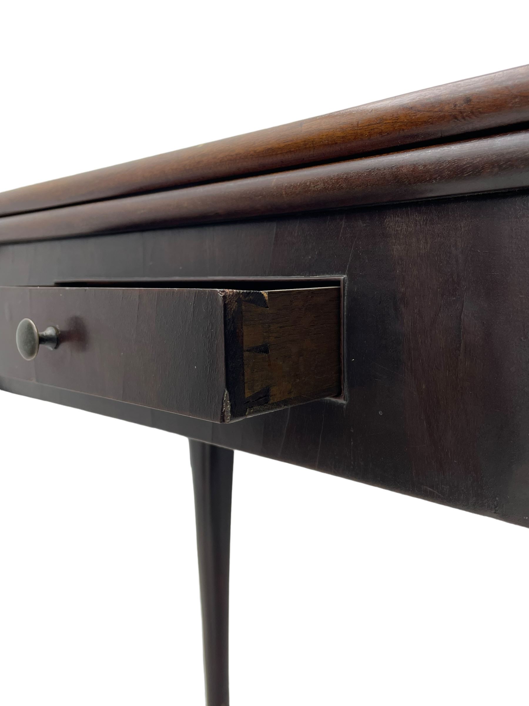 Late 18th century Irish mahogany tea table, rectangular form with projecting stepped rounded corners, fold-over action top over single frieze drawer within cock-beaded surround, on shell and bellflower carved cabriole supports, single gate-leg action base 