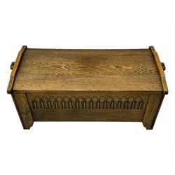 20th century oak coffer or blanket chest, rectangular hinged top over repeating Gothic arch carved front and shaped sides, constructed with pegged joints, on stile supports