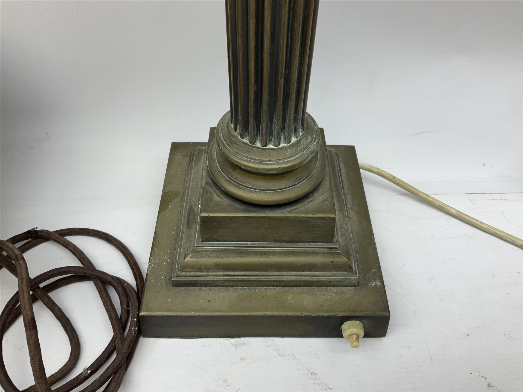 Victorian brass oil lamp converted to electricity, the square stepped base with a reeded doric column leading to a cut clear glass reservoir and burner and spherical shade with printed bird decoration, together with another similar shade and oil lamp parts and accessories etc