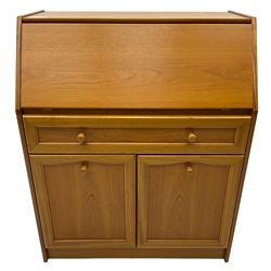 Mid 20th century teak bureau, sloped fall-front opening to reveal fitted interior with compartments, over panelled full width drawer and two cupboard doors, on recessed plinth base