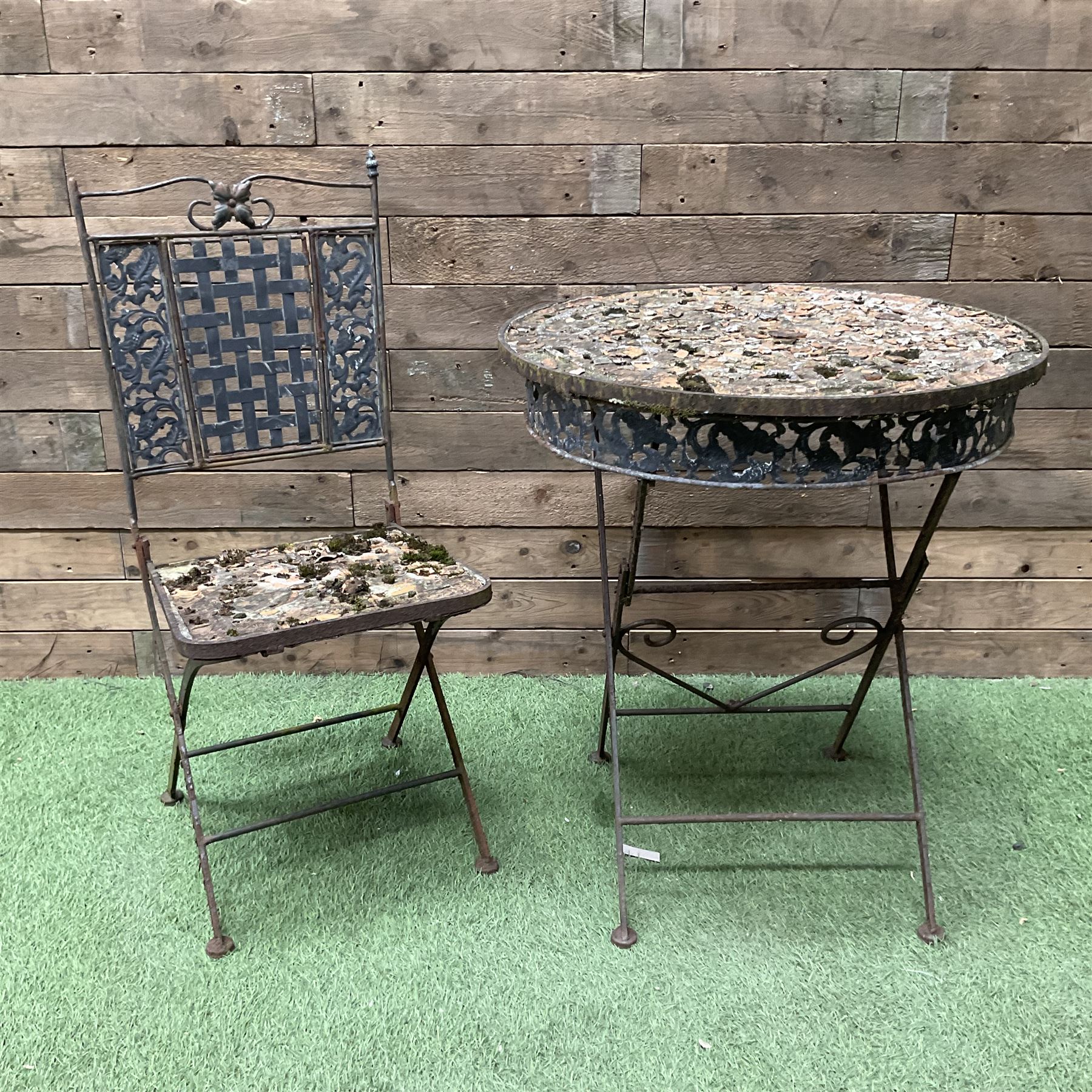 Circular metal garden table with tile top and matching chair, weathered - THIS LOT IS TO BE COLLECTED BY APPOINTMENT FROM DUGGLEBY STORAGE, GREAT HILL, EASTFIELD, SCARBOROUGH, YO11 3TX