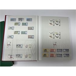 Queen Elizabeth II mint decimal stamps, housed in two stock book folders, face value of usable postage approximately 570 GBP