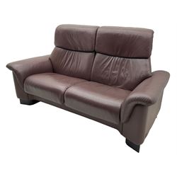 Ekornes Stressless - three-seat sofa upholstered in chocolate brown leather, with high backrests, cushioned headrests, and manual reclining mechanism (L248cm, D84cm, H102cm); with matching two-seat sofa (L184cm, D84cm, H102cm)