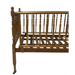 Victorian beech and pitch pine crib, turned spindle gallery supports, raised on square tapering supports with castors