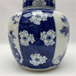 Chinese blue and white ginger jar, painted with bamboo and blossoming trees in panels against a flowerhead ground, H24cm