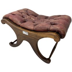 Late 20th century mahogany curved x-framed footstool, upholstered in buttoned red leather, splayed supports united by turned stretchers 