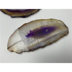 Three purple agate slices, polished with rough edges, of various sizes largest H7cm, L10cm