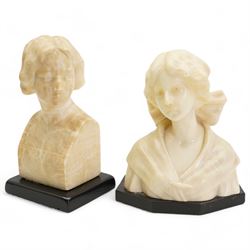 Early 20th century alabaster of a young girl, wearing a ribbon in her hair, on a black marble base, H19.5cm and another carved female bust on an ebonised base, H20.5cm (2)