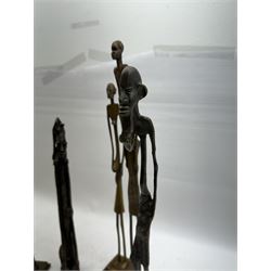 Five bronzed tribal figures, of elongated form, tallest H18cm