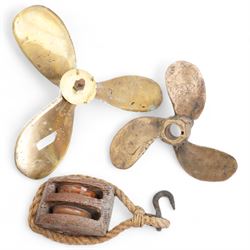 Two brass boat propellors, W37cm max, together with a wooden ships pulley (3)