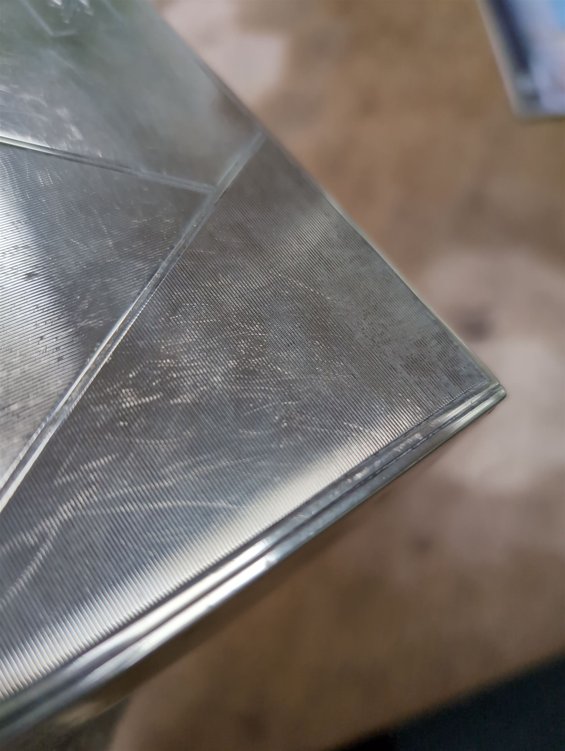 1930s silver mounted cigarette box, of rectangular form, with engine turned decoration and engraved cartouche to hinged lid, opening to reveal a softwood interior, hallmarked London 1930, maker's mark worn and indistinct