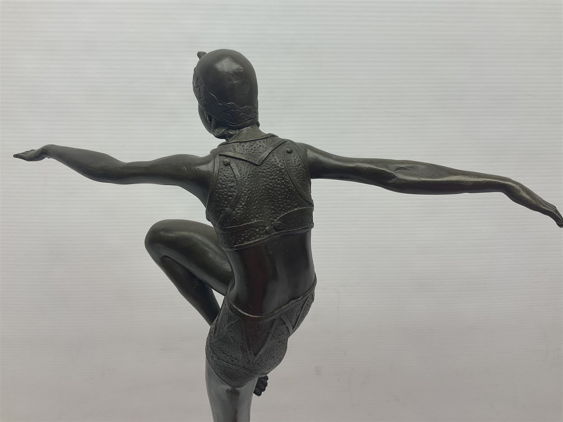 Art Deco style bronze, after Philipp, modelled as a dancer with her arms outstretched and one leg raised, on a veined marble tapering base signed Philipp and with foundry seal, H58cm