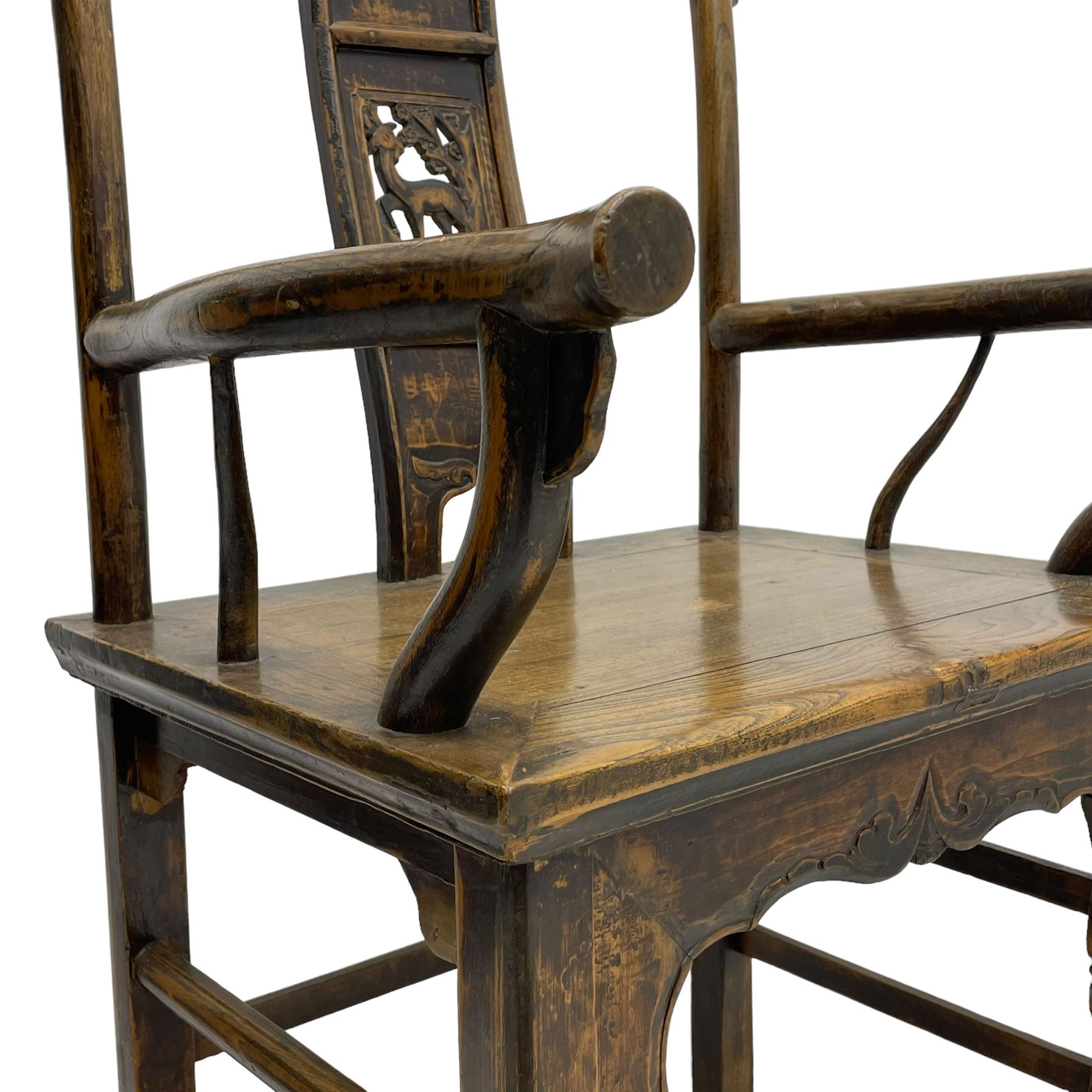 Chinese design elm yoke back 'official's' armchair, the shaped cresting rail over splat decorated with carved and pierced wildlife scenes, shaped projecting arms over rectangular seat, square supports united by plain stretchers, decorated with shaped frame brackets carved with foliage