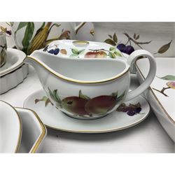 Royal Worcester Evesham pattern, including covered pot de cremes, twin handle tureen, serving dishes, flan dishes, side plates etc  