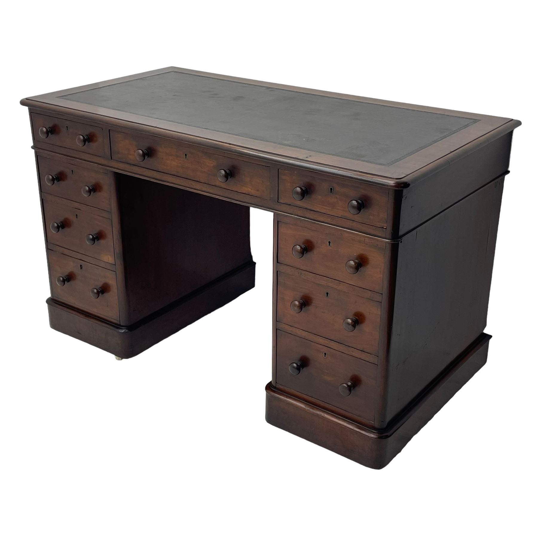 Victorian mahogany twin pedestal desk, moulded rectangular top with inset leather writing surface, nine drawers each fitted with two turned handles, on moulded plinth base 