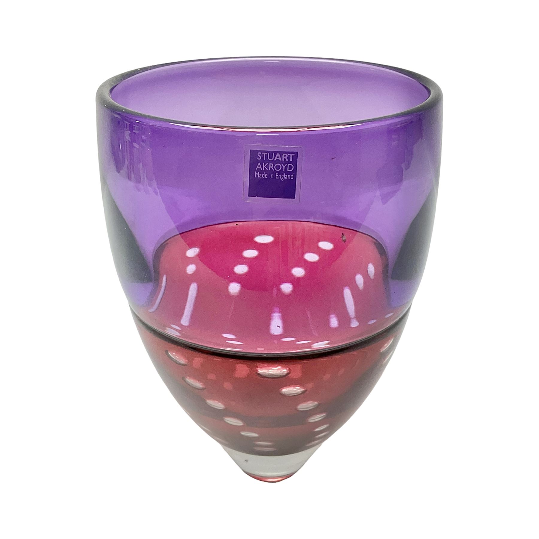 Stuart Akroyd tapering glass vase, purple banded top and cranberry red lower section with bubble inclusions, with sticker and engraved signature beneath, H19cm