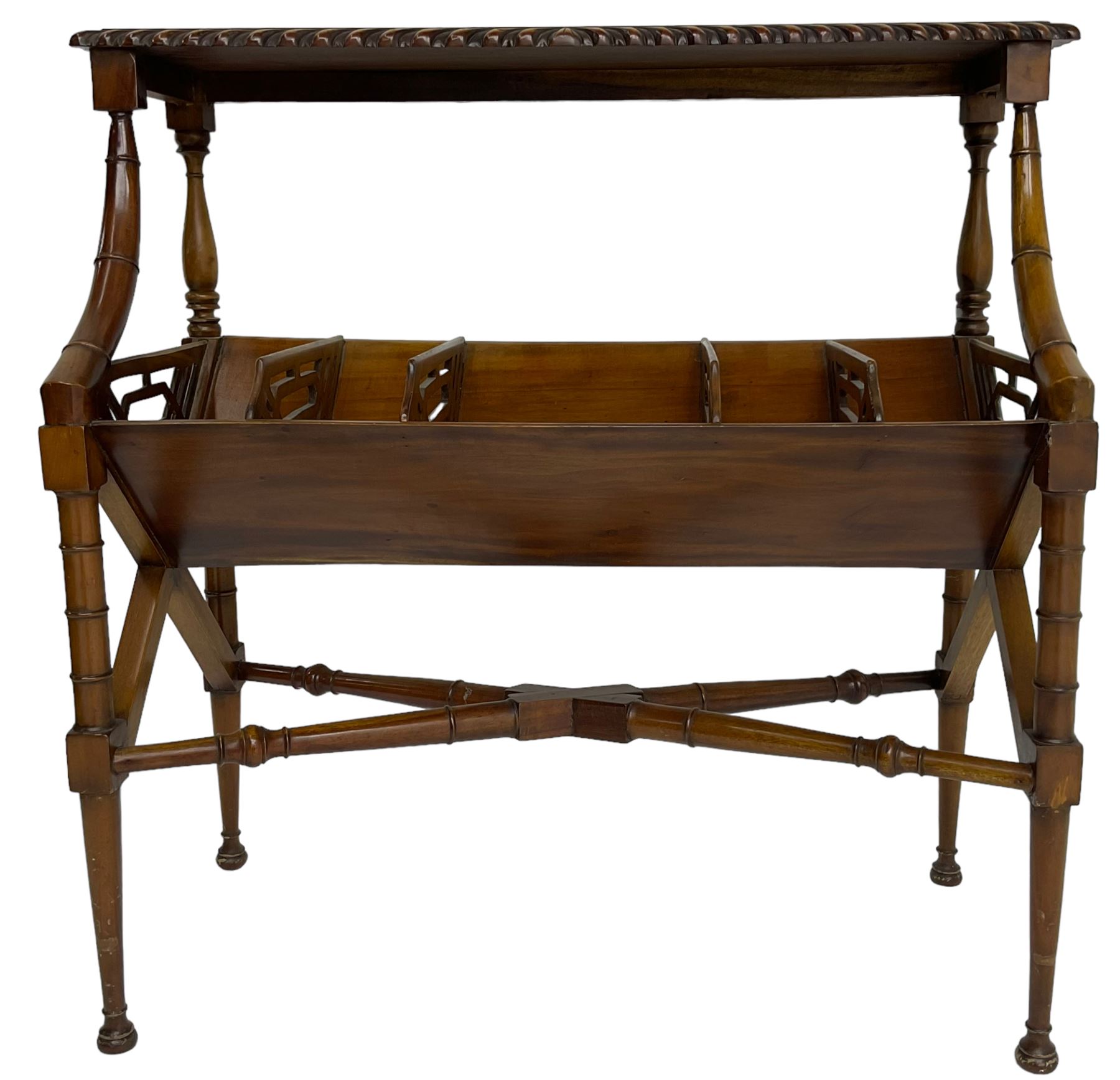 Early 20th century Chippendale design mahogany booktrough, top-tier with gadrooned edge, the trough fitted with trapezoid fretwork dividers, raised on ring turned supports united by X-stretcher 